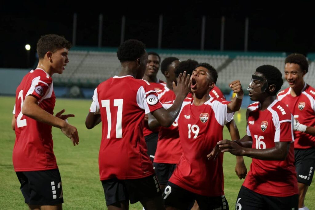 TT under-14 boys' football team captain Adasa Richardson (second from left) celebrates with his teammates after giving his team the lead in their CFU Under-14 Boys' Challenge Series match against Aruba at the Dwight Yorke Stadium in Bacolet, Tobago on August 17. - Photo courtesy TTFA