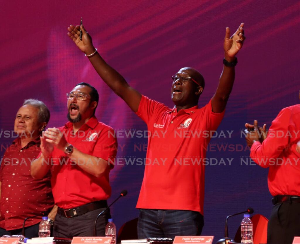 LET'S DO THIS: Prime Minister Dr Keith Rowley sings along to Isasha's song Let's Do This during the PNM's Special Convention at the National Academy for Performing Arts, Port of Spain on August 18.
Also in the photo are Finance Minister Colm Imbert and Energy Minister Stuart Young. - Photo by Ayanna Kinsale