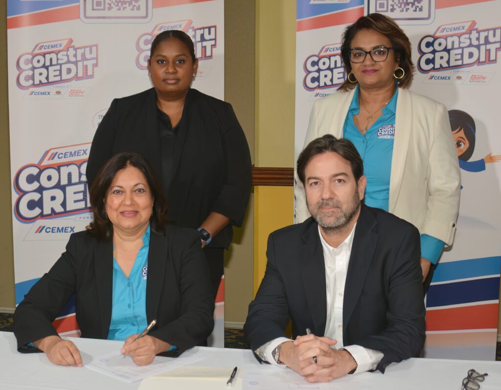 Sharon Maharaj (left), director, consumer finance, Unicomer (Trinidad) Ltd and Gonzalo Rueda Castillo, general manager, Cemex TCL, sign the ConstruCredit partnership documents. 
Also seen in the photo are Kearlene Crosby, left, manager, digital payments, Unicomer (Trinidad) Ltd and Reshma Gooljar-Singh, sales distribution segment manager, Cemex TCL. 
- Photo courtesy Unicomer (Trinidad) Ltd