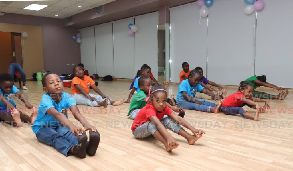 Hope for Youth Activity Club summer campers showed off their yoga prowess at the Iyerzone Yoga Center on August 19.  - Photo by Faith Ayoung