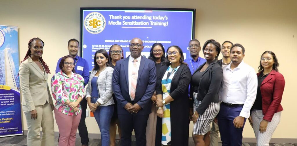 Kester Guy, TTSEC CEO, centre, is photographed with participants of TTSEC's media sensitisation session on August 15. - 