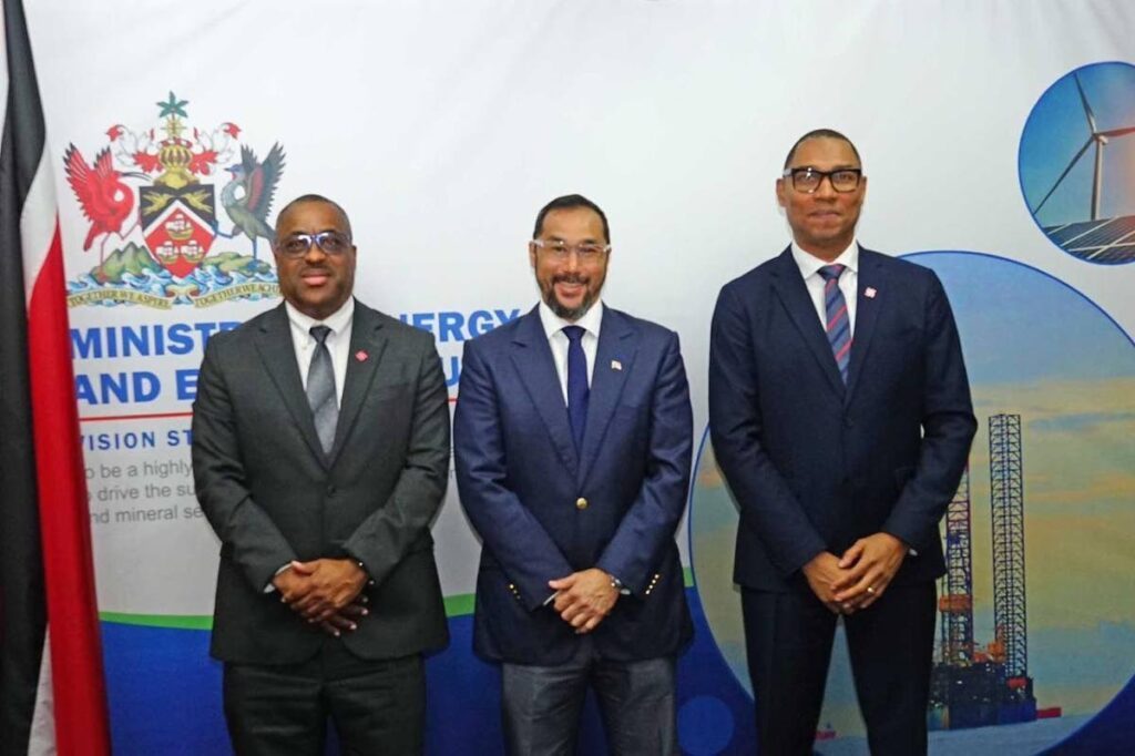 Minister of Energy Stuart Young (middle) stands with CEO Ronald Addams (right) and COO Jean Andre Celestain at the ministry's office at the International Waterfront Complex in Port of Spain on August 19. - 