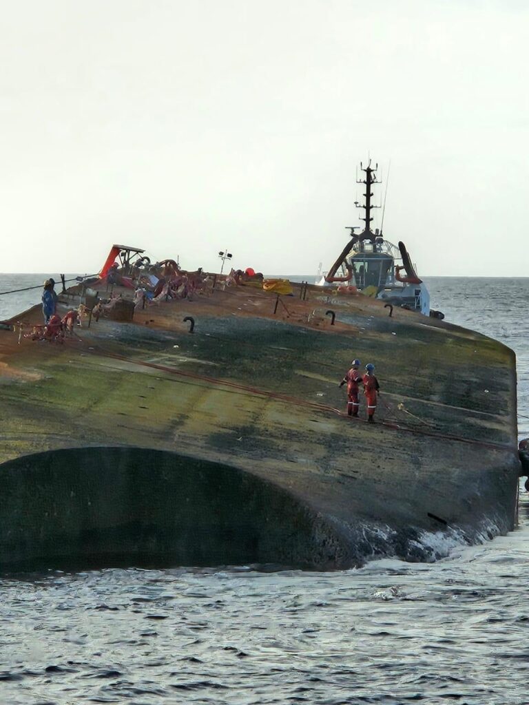 The overturned barge Gulfstream, which has been grounded since February 7 off the coast of the Cove Eco Industrial Park, Tobago, was successfully refloated on August 19. - Photo courtesy Ministry of Energy