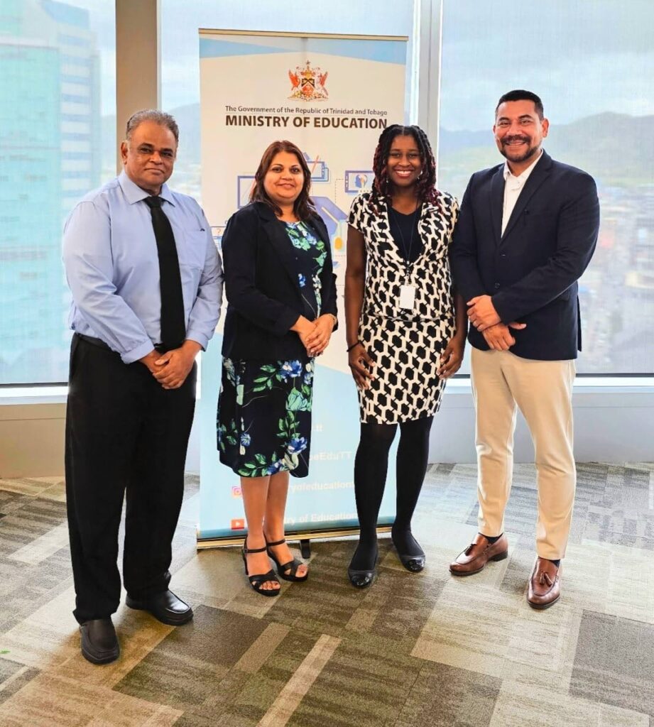 Edwin Ramsaran, acting school supervisor, Ministry of Education, left;  Vashti Ramdeen-Steele, external affairs co-ordinator, Ministry of Education; Natalie Wilson, Solve for Tomorrow promoter; and Christian Martinez, regional director at Glasswing International.  - 