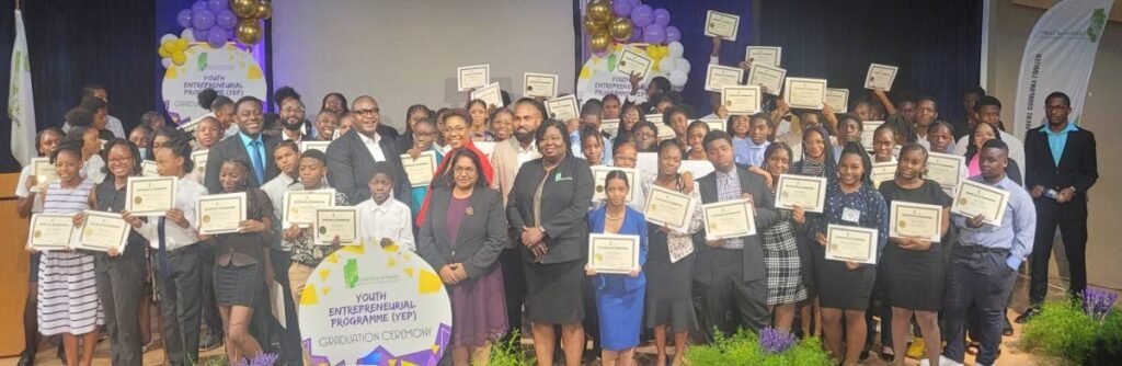 CELEBRATION TIME: Graduates of the Youth Entrepreneurship Programme and officials from the Ministry of Housing and Urban Development and EPOS, pose for a photo at the graduation ceremony, held at the Government Campus Plaza Auditorium, Port of Spain, on August 16.
Photo courtesy EPOS - 