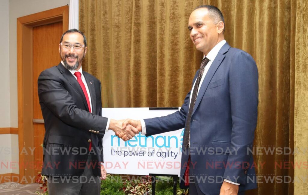 Energy Minister Stuart Young, left, shakes hands with Methanex Trinidad Ltd managing director and president Colin Bain, at Methanex's live methanol bunkering demonstration at Hyatt Regency, Port of Spain on August 21.  - Photo by Gabriel Williams