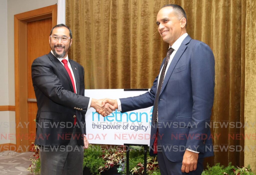 Energy Minister Stuart Young shakes hands with Colin Bain, managing director and president of Methanex Trinidad Ltd at Methanex's bunkering demonstration at Hyatt Regency, Port of Spain on August 21. - Photo by Gabriel Williams