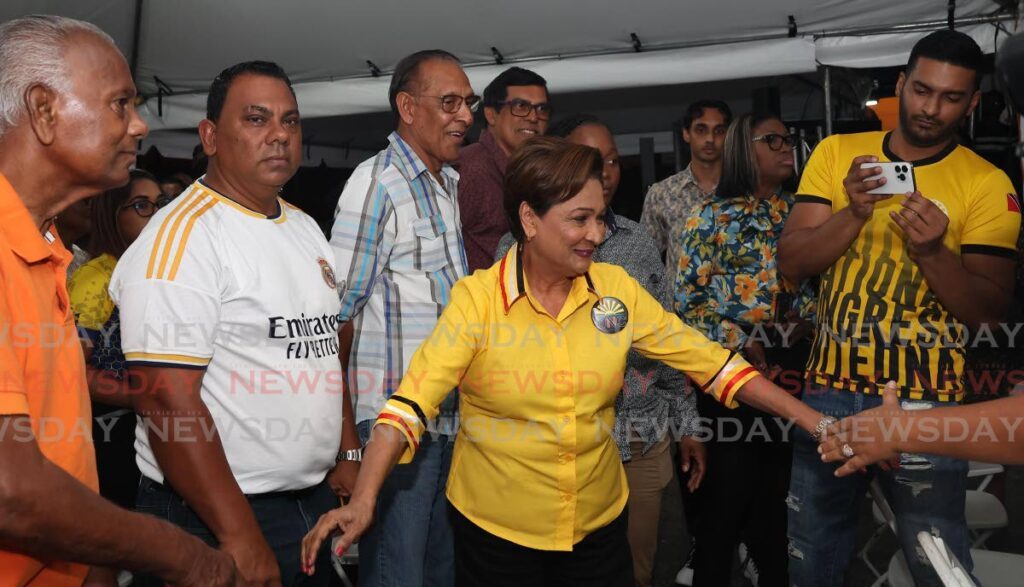 Opposition Leader, Kamla Persad Bissessar, greets supporters at the UNC Pre Budget Consultation held at the Siparia Constituency 
Office on August 21. - Photo by Venessa Mohammed