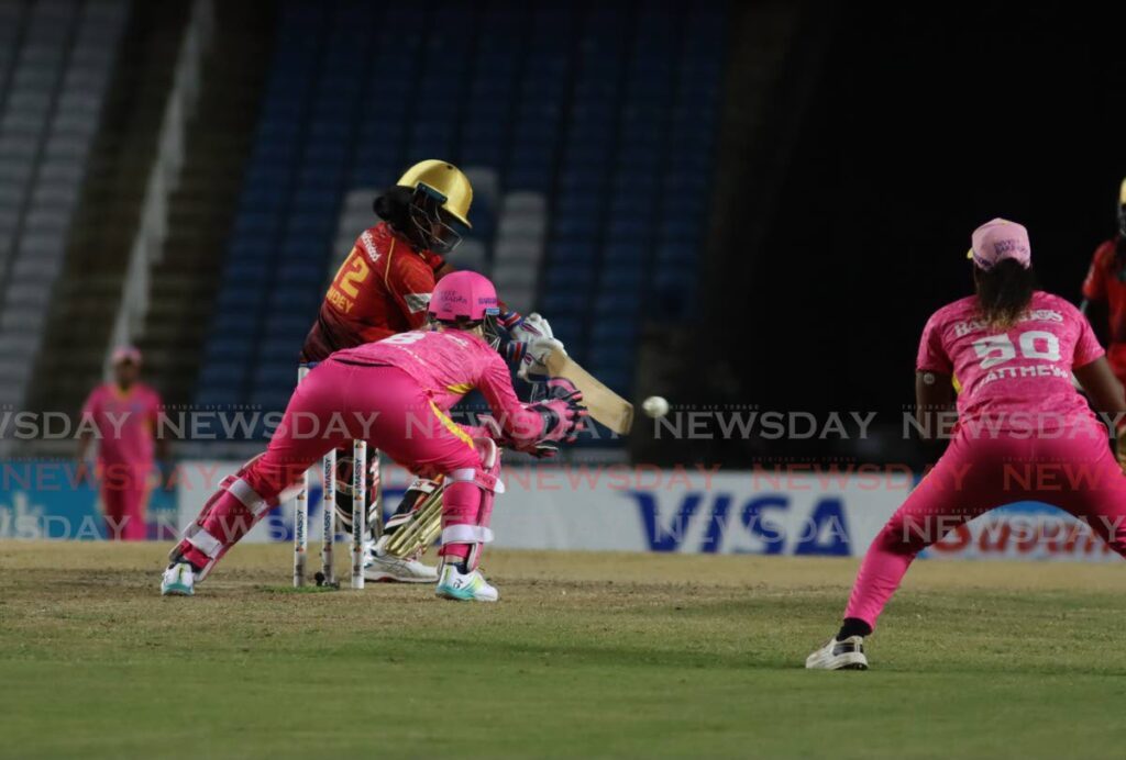 TKR batter Shikha Pandey plays a shot on the off side as Barbados Royals wicketkeeper Georgia Redmayne and Hayley Matthews look on. - Photo by Ayanna Kinsale