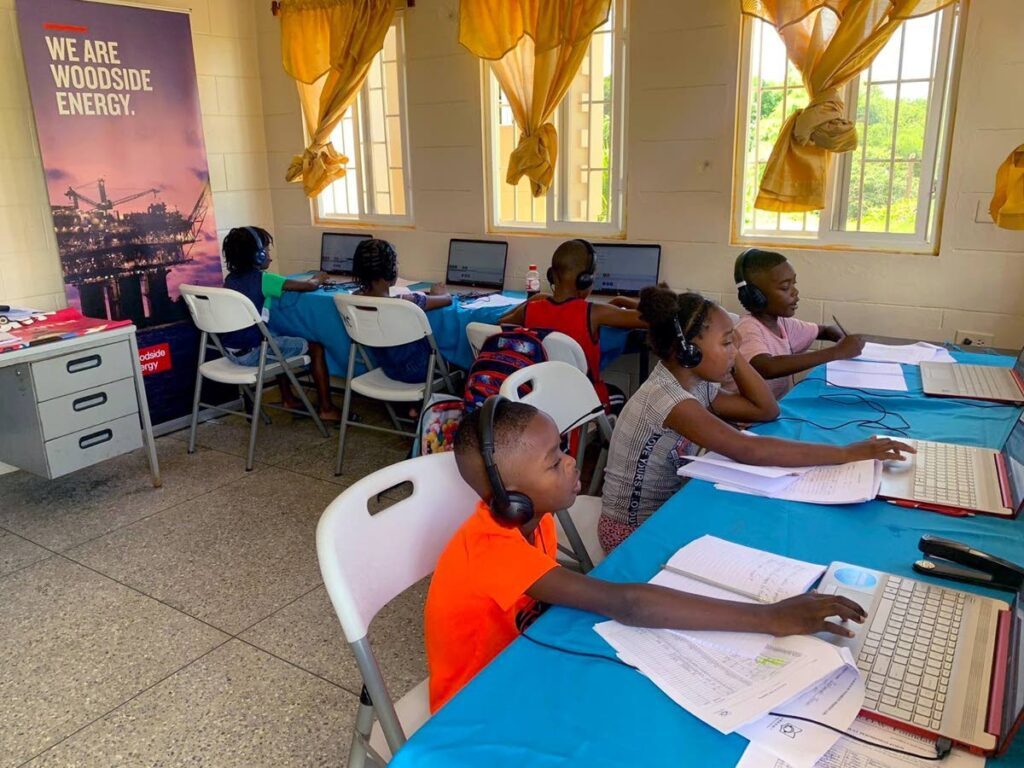 Pupils at Toco Regional Complex are absorbed in the July-August literacy training workshops.  - 