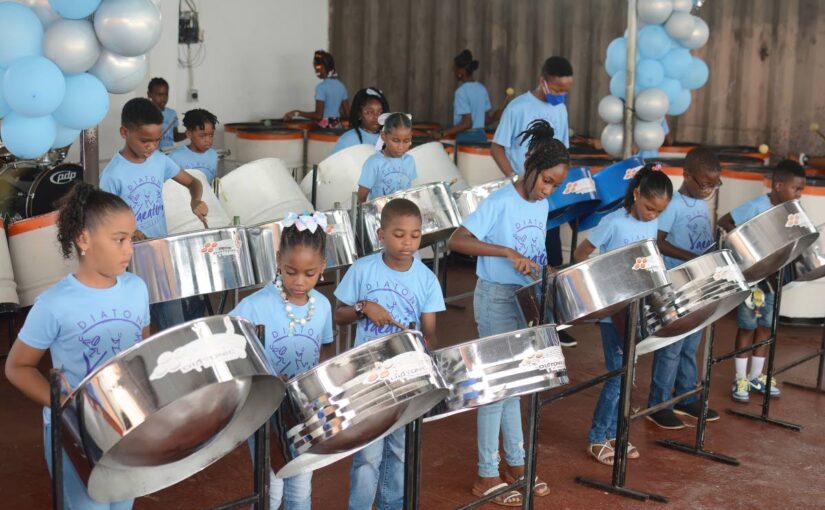 Participants learn to play the steel pan.