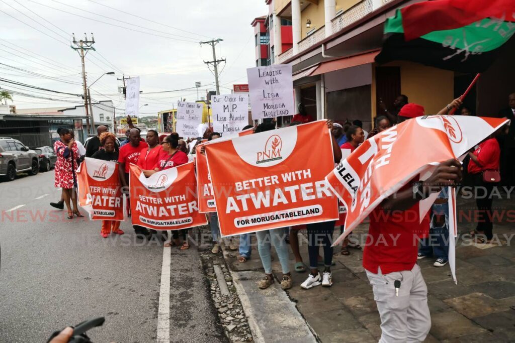 PNM supporters outside Omardeen building along Cipero Street in San Fernando as potential candidates faced the party's screening committee on August 23. - Photo by Lincoln Holder 