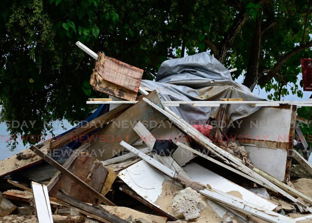 A vendor's stall lies in ruins after it was demolished by police at Swallow's Beach, Pigeon Point Road, Tobago, on August 23. - Photo by Visual Styles 