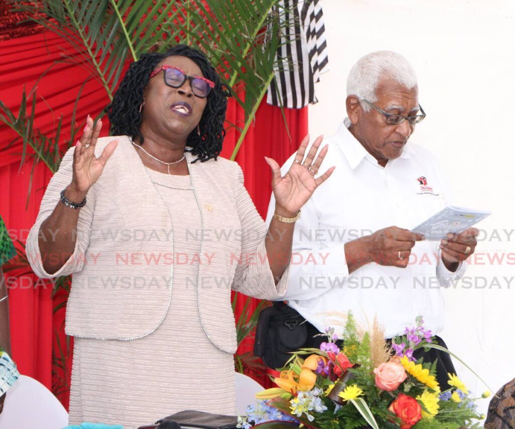 Pan Trinbago President Beverley Ramsey-Moore enjoys the worship session at the organisation's annual thanksgiving service, at its Dundonald Street, Port of Spain, headquarters on August 25. - Photo by Angelo Marcelle