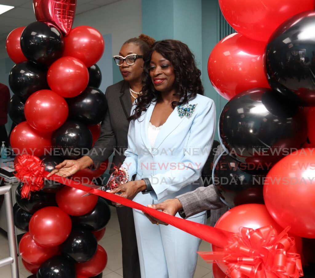 Donna Cox, Minister of Social Development and Family Service cuts the ribbon at opening ceremony for the Ministry of Social Development's Port of Spain Social Services Centre on Henry Street, Port of Spain on August 26. - Photo by Gabriel Williams