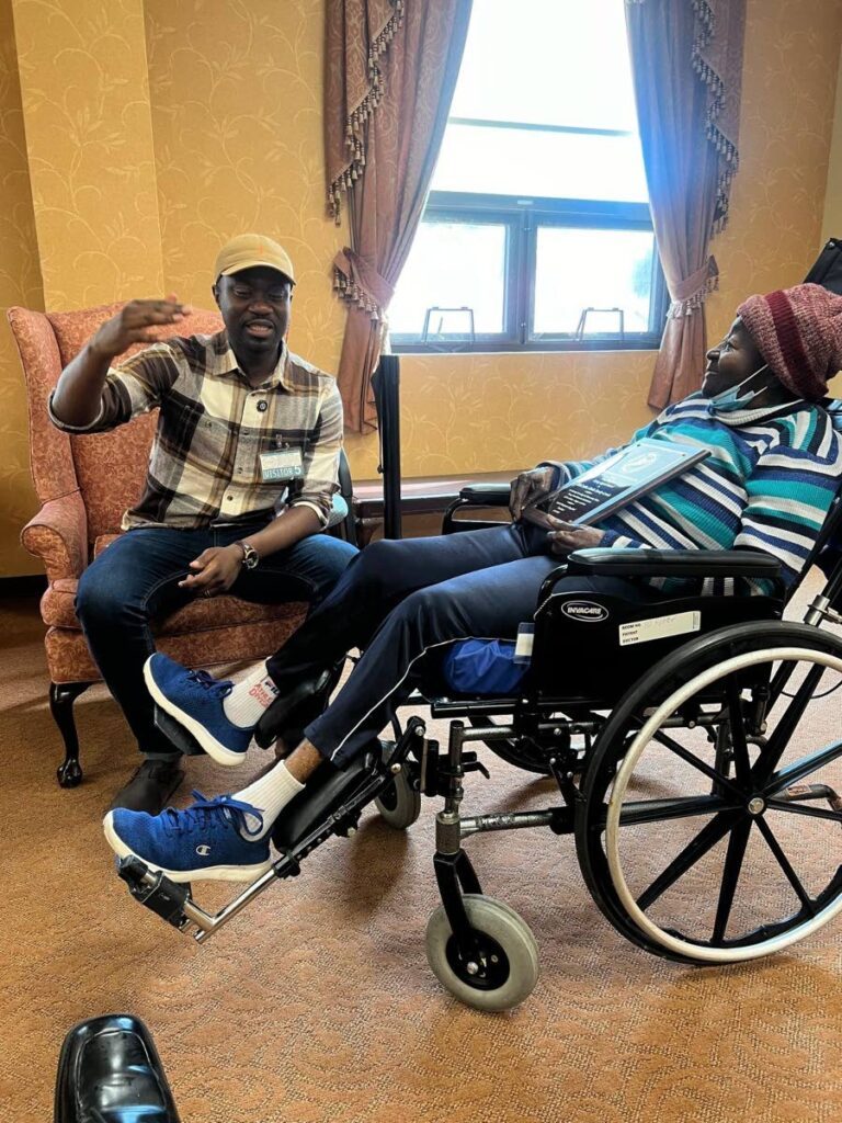 THA Chief Secretary Farley Augustine chats with Calypso Rose  on August 19 in New York.  - courtesy Derek Parsons