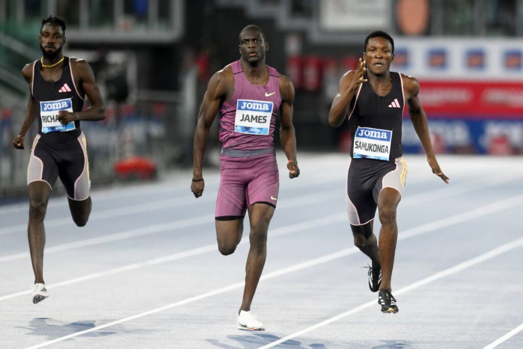 Muzala Samukonga, of Zambia, right, runs ahead of Kirani James, of Grenada, centre, and Jereem Richards, of Trinidad And Tobago, to win the men's 400 meters during the Diamond League Golden Gala Pietro Mennea athletics meet at the Stadio Olimpico in Rome, August 30. - AP