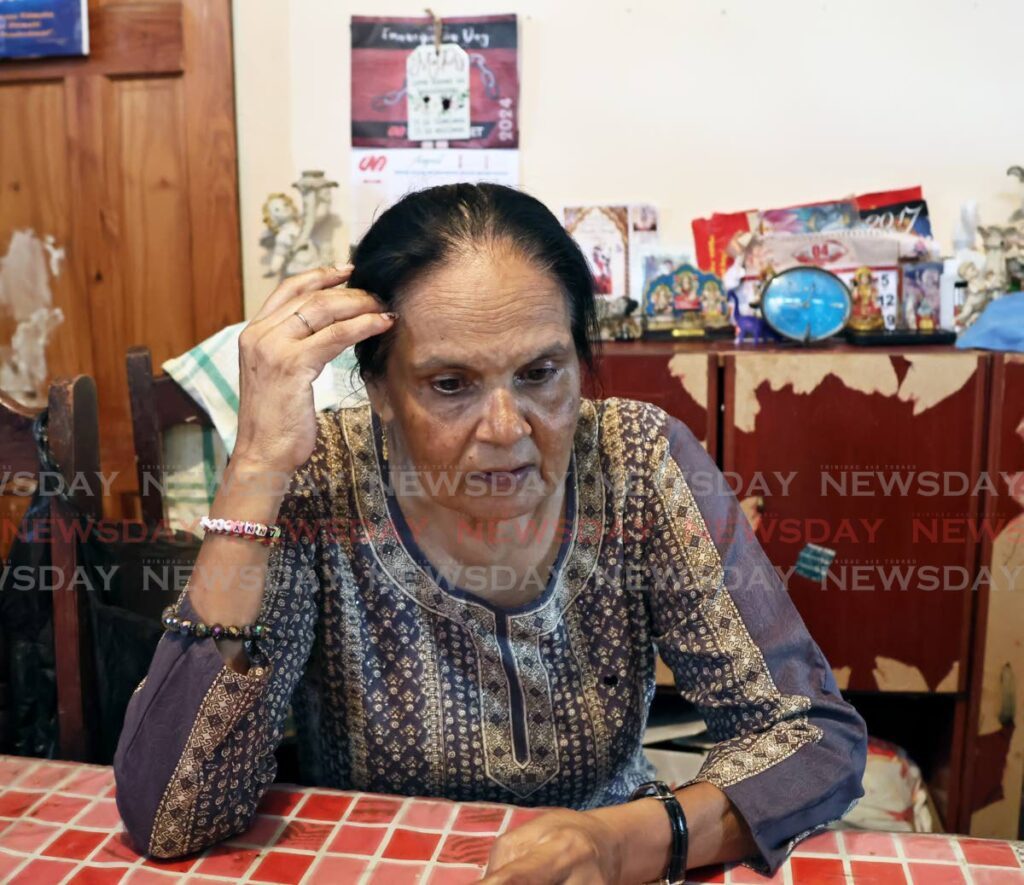 Tara Chaitram, 63, whose son Rajeev Chaitram drowned at a beach in Mayaro on August 31, speaks with members of the media at her home in Cedar Hill, Princes Town. - Photo by Venessa Mohammed