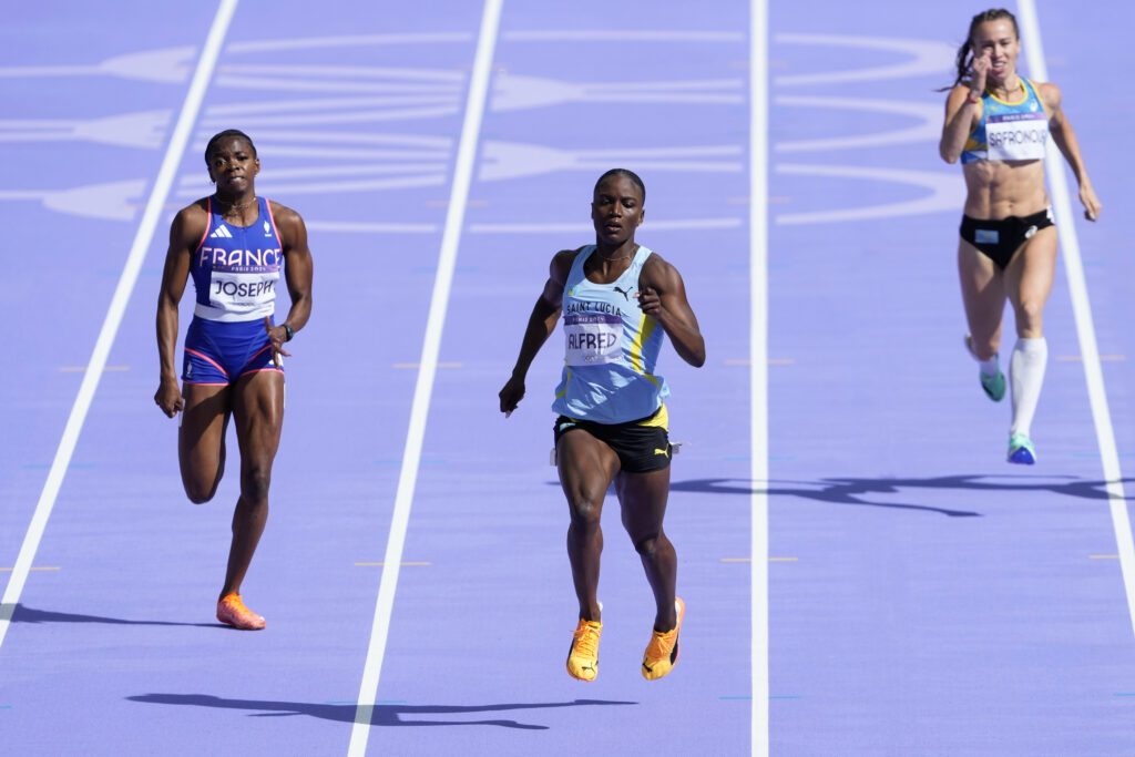 Julien Alfred, of Saint Lucia, and Gemima Joseph, of France, left, compete in a women's 200 metres round one heat at the 2024 Olympics on August 4 in Saint-Denis, France. - AP PHOTO