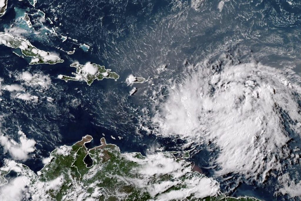 This satellite image shows Tropical Storm Ernesto over the Atlantic Ocean and moving west-northwest toward the Lesser Antilles on August 12. - Photo courtesy NOAA via AP