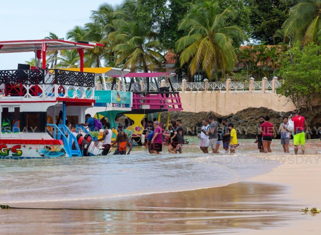 Visitors board the Coral Princess Tours, to head out to the Nylon Pool and Buccoo Reef from Store Bay. - 