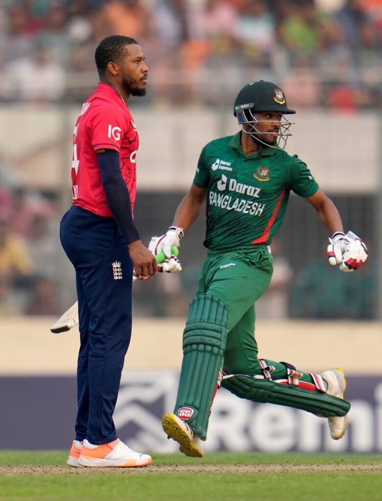 In  this March 14, 2023 file photo, England's Chris Jordan (L) follows the ball after a shot played by Bangladesh's Najmul Hossain Shanto (R) during the third and last T20 in Dhaka, Bangladesh. - AP PHOTO