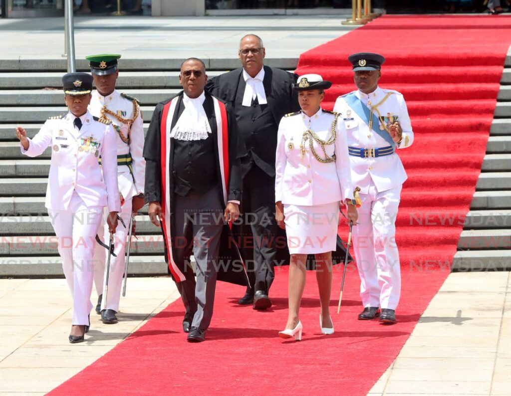 Chief Justice Ivor Archie walks the red carpet to inspect the parade at the National Academy for the Performing Arts for  opening of the 2023-2024 law term in 2023.
In response to complaints about religious leaders being left out of the law term's opening on September 20, Archie says the issue cannot be resolved before September 20.  - File photo