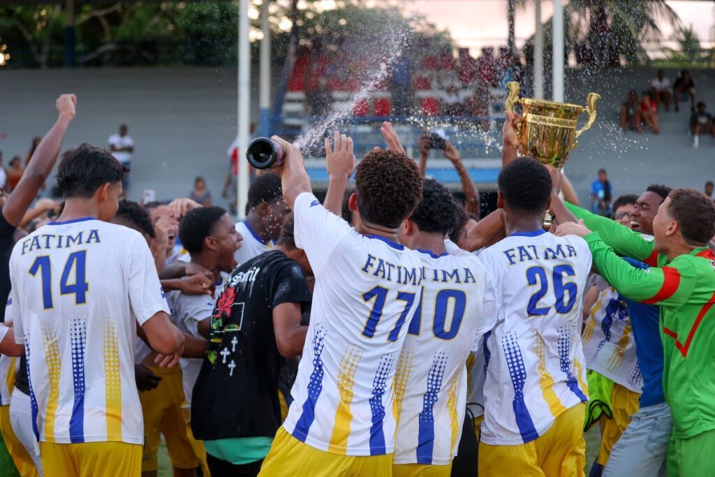 In this October 28, 2023 file photo, Fatima college players celebrate their 2023 SSFL Premiership title after defeating Naparima College 2-1 during the SSFL Premiership match, at Naparima grounds, Lewis Street, San Fernando. - Photo by Daniel Prentice