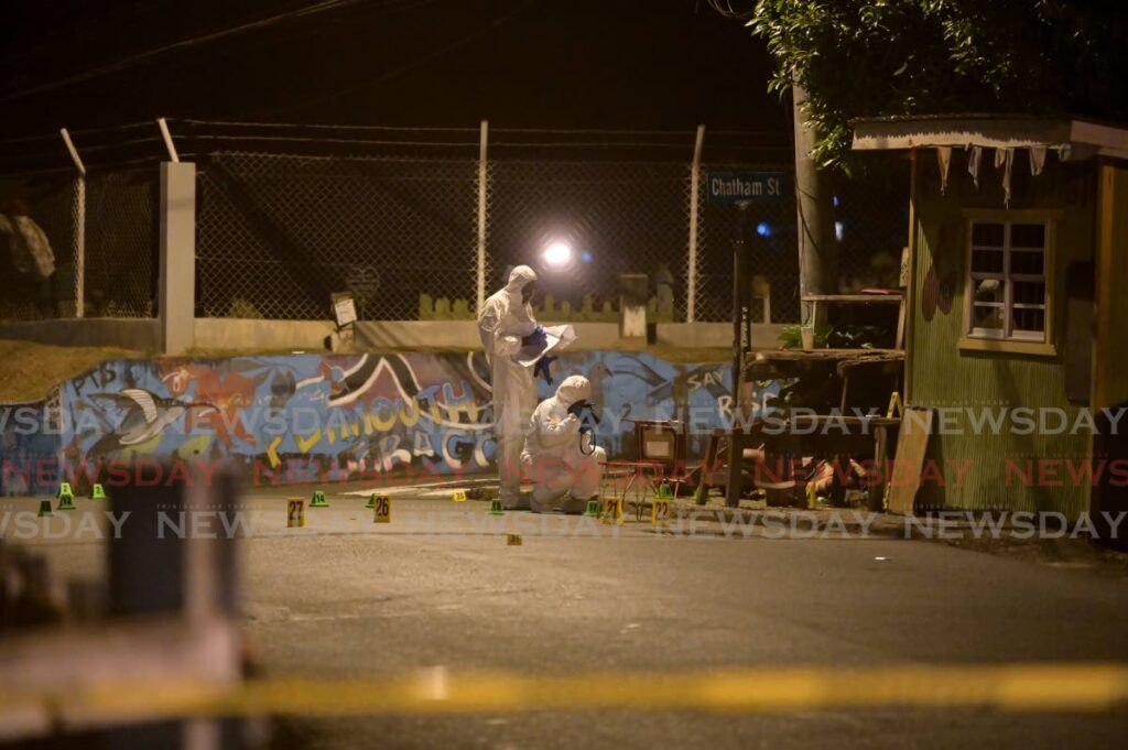 Crime Scene Investigators collect evidence after Anthony Maynard was killed in May in Plymouth, Tobago.  - File Photo 