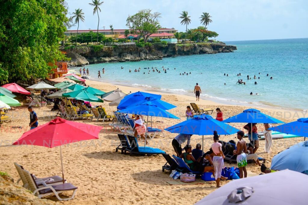 In this file photo, tourists and visitors flock to Store Bay, Tobago.  - Photo by Visual Styles