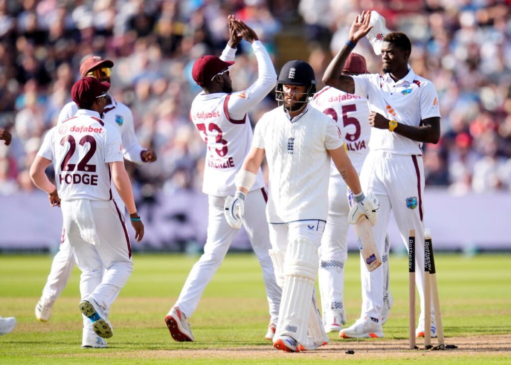 FILE: West Indies fast bowler Alzarri Joseph, right, celebrates the wicket of England’s Ben Duckett with his team-mates during day a Test match at Edgbaston, Birmingham, in England on July 26. AP PHOTO - 