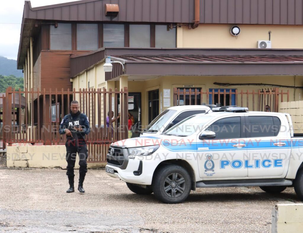 A policeman at the Forensic Science Centre, St James on August 13. - File photo by Faith Ayoung