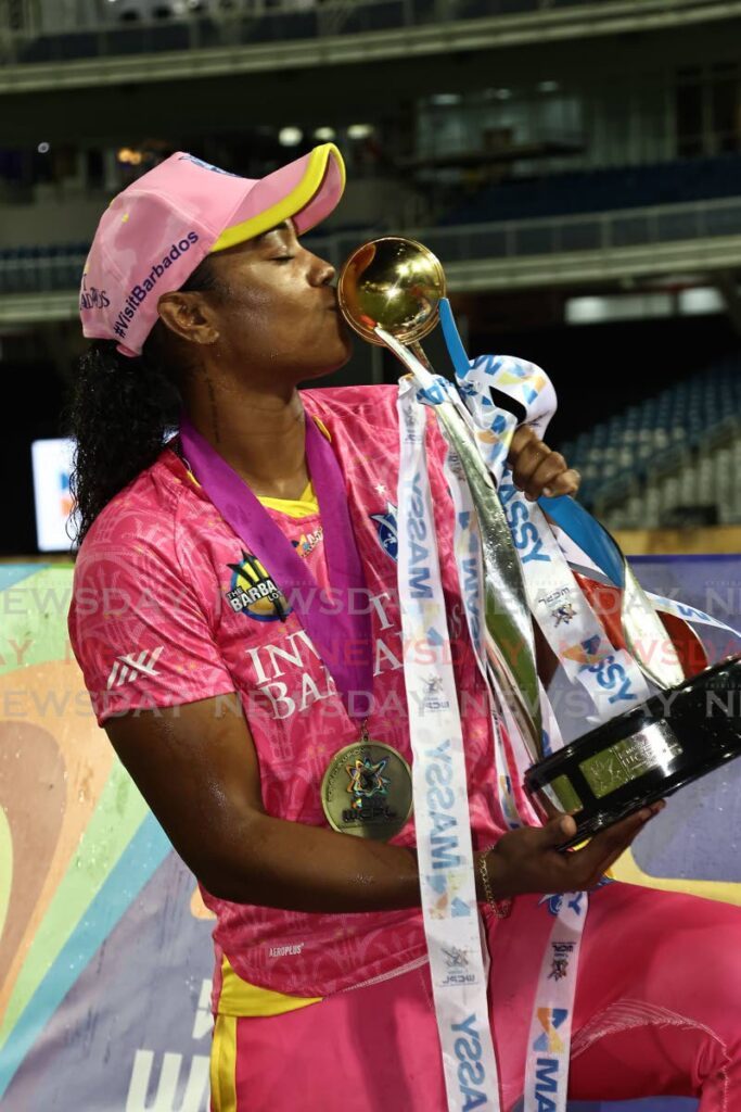 Barbados captain Hayley Matthews kisses the Massy WCPL trophy after defeating TKR at the Brian Lara Cricket Academy, Tarouba, August 29. - Photo by Lincoln Holder