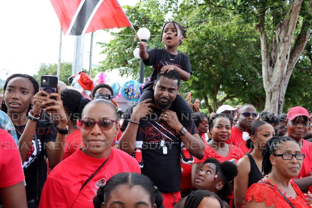 Spectators fill the pavement opposite the Queen's Park Savannah, Port of Spain, to see the Independence Day parade on August 31.  - Photo by Ayanna Kinsale 