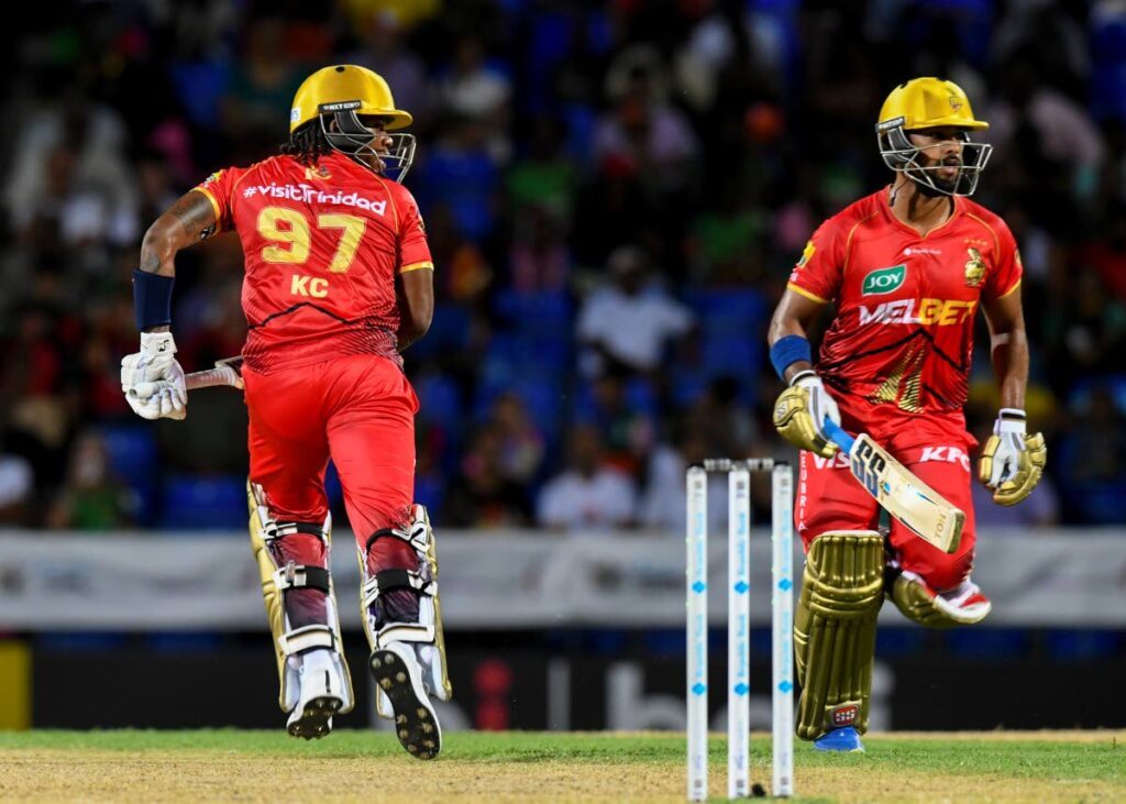 Nicholas Pooran, right, and Keacy Carty of Trinbago Knight Riders bat during the 2024 Republic Bank Caribbean Premier League match against St Kitts and Nevis Patriots at Warner Park on August 31 in Basseterre, St Kitts. Photo by Randy Brooks/CPL T20 via Getty Images) - CPL via Getty Images