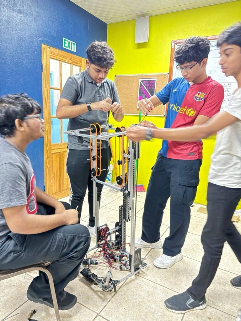 Presentation College, Chaguanas students build their robot for the 2024 First Global Challenge. - 