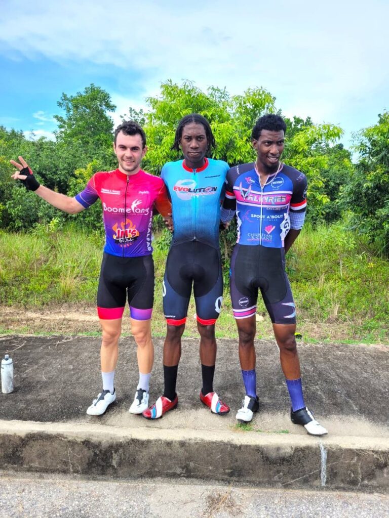 Road Challenge criterium winner Tariq Woods, centre, with runner-up Enrique De Comarmond, left, and third-place finisher Maurice Burnett. PHOTO COURTESY TT CYCLING FEDERATION   - 