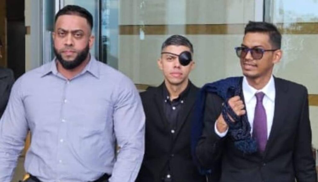 Eisa Ghany, left, Anzar Mohammed and attorney Richard Jaggasar at the Waterfront Judicial Center, Port of Spain, on September 3. - 