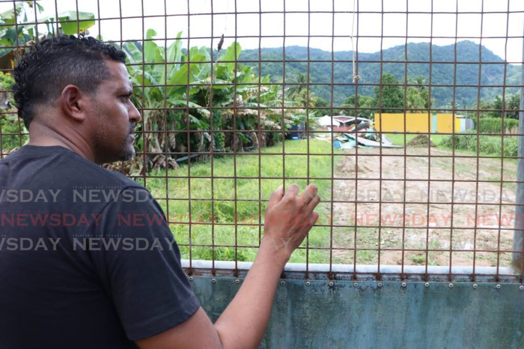 Diego Martin farmer Avellino Thomas, stands outside a bulldozed section of land at Mahogany Trace on September 3. The land, occupied by his family for agricultural use, has been designated for the second phase of the Diego Martin Sporting Complex by Udecott. - Photo by Angelo Marcelle