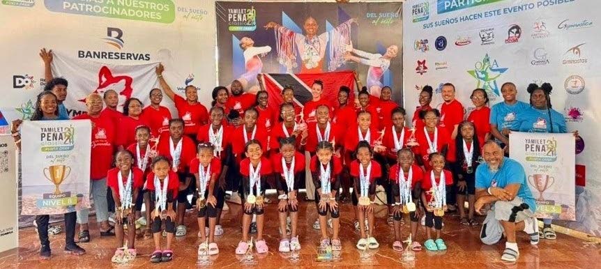 Head coach Dale Ali (bottom right) poses with his Olympia Wolfpack Gymnastics team at the Yamilet Pena Gymnastics Classic which was contested in Punta Cana, Dominican Republic from August 24-25. Photo courtesy Olympia Wolfpack Gymnastics.  - 