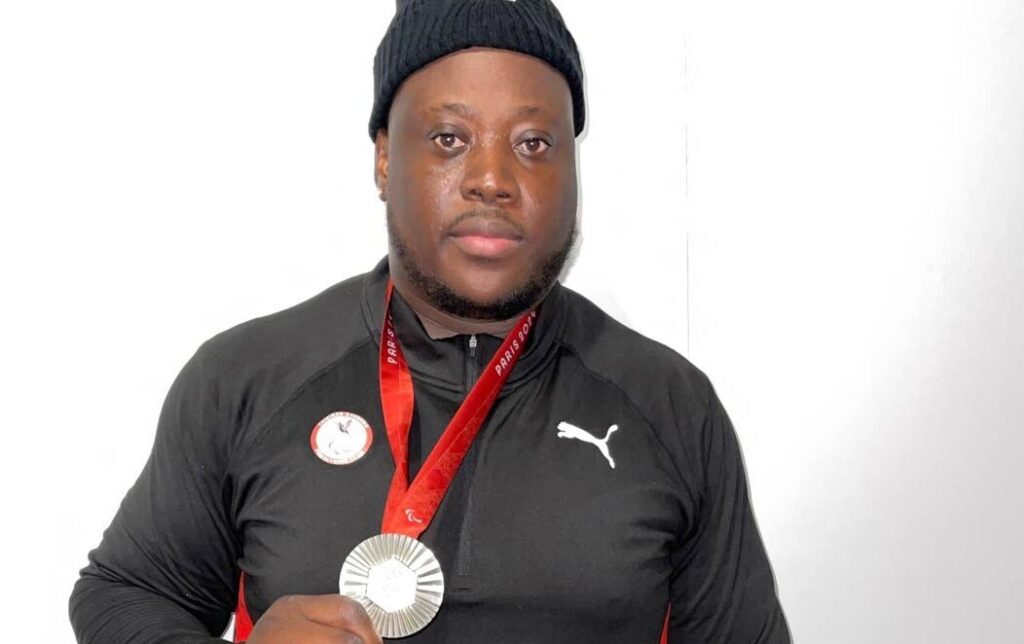 Trinidad and Tobago's Akeem Stewart displays his Paralympic Games men's discus F64 silver medal at the Stade de France on September 5.  - Photo courtesy TT Paralympic Committee