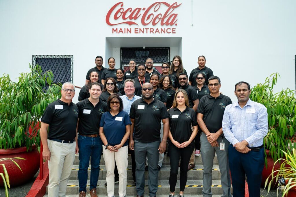 Minister of Trade and Industry Paula Gopee-Scoon, (third from left), permanent secretary Randall Karim (right) among CBTTL and Coca Cola Company executives during a tour at the CBTTL Headquarters in Macoya on September 4, 2024. - Photo courtesy Ministry of Trade and Industry 