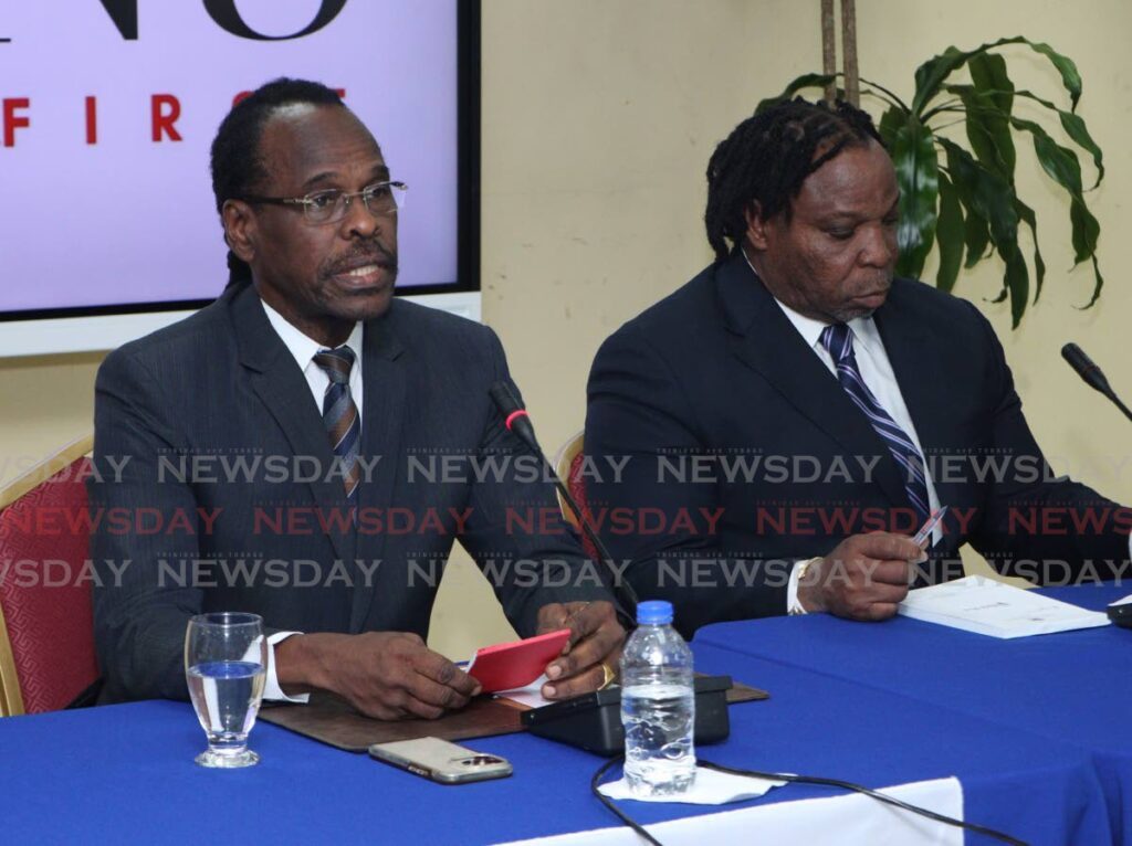 In this file photo, Minister of National Security Fitzgerald Hinds, left, speaks at a press briefing alongside Minister in the Ministry of National Security (in charge of policing) Keith Scotland, at the Ministry of National Security's Port of Spain head office on September 6. - Photo by Angelo Marcelle