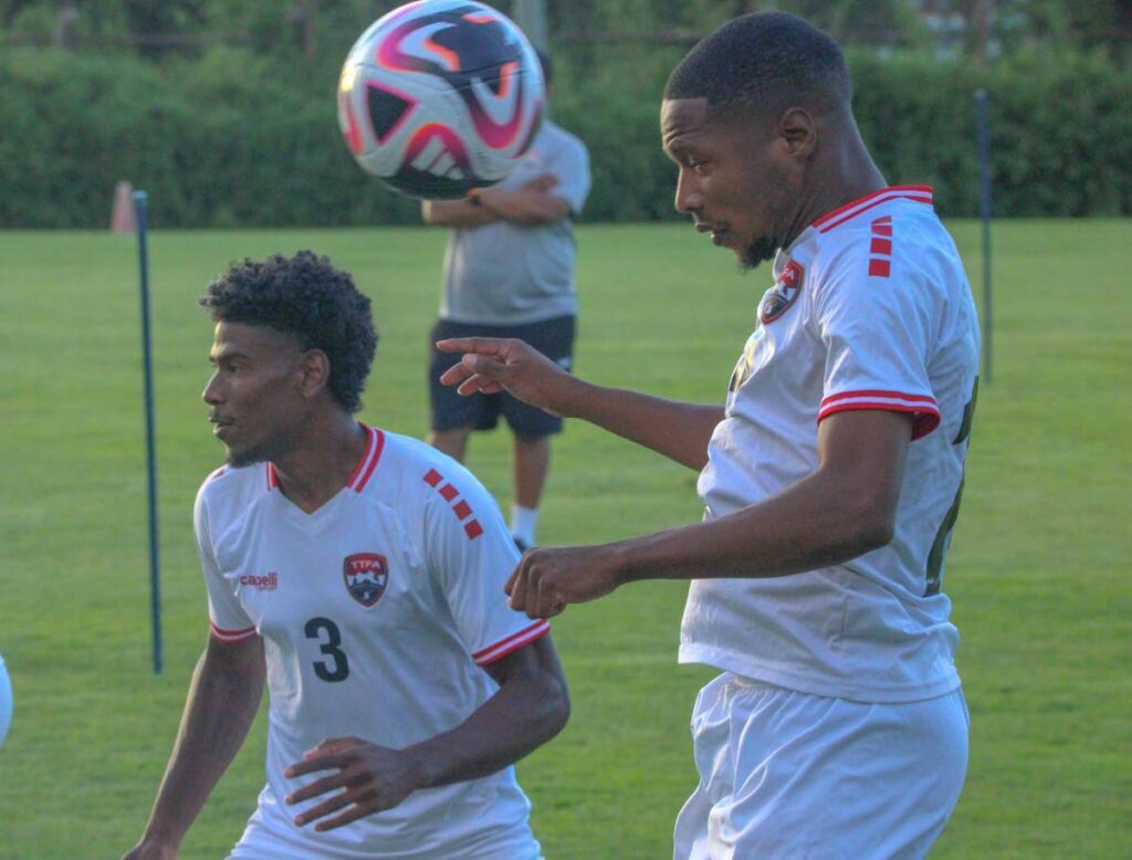 Andre Rampersad, left, and Shannon Gomez train with the Soca Warriors ahead of the Concacaf Nations League match against Honduras. - PHOTO COURTESY TT FOOTBALL ASSOCIATION 