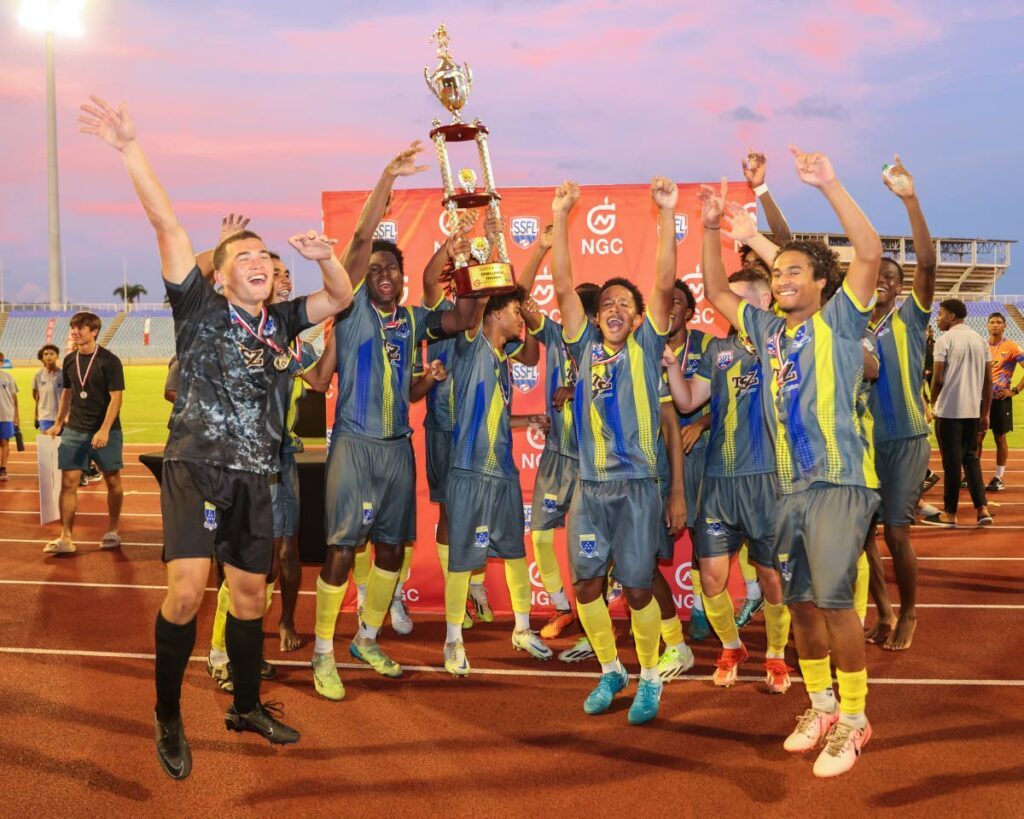 Fatima College celebrate their victory in the SSFL NGC Super Cup match after defeating Presentation College, San Fernando 2-1. - Photo by Daniel Prentice 