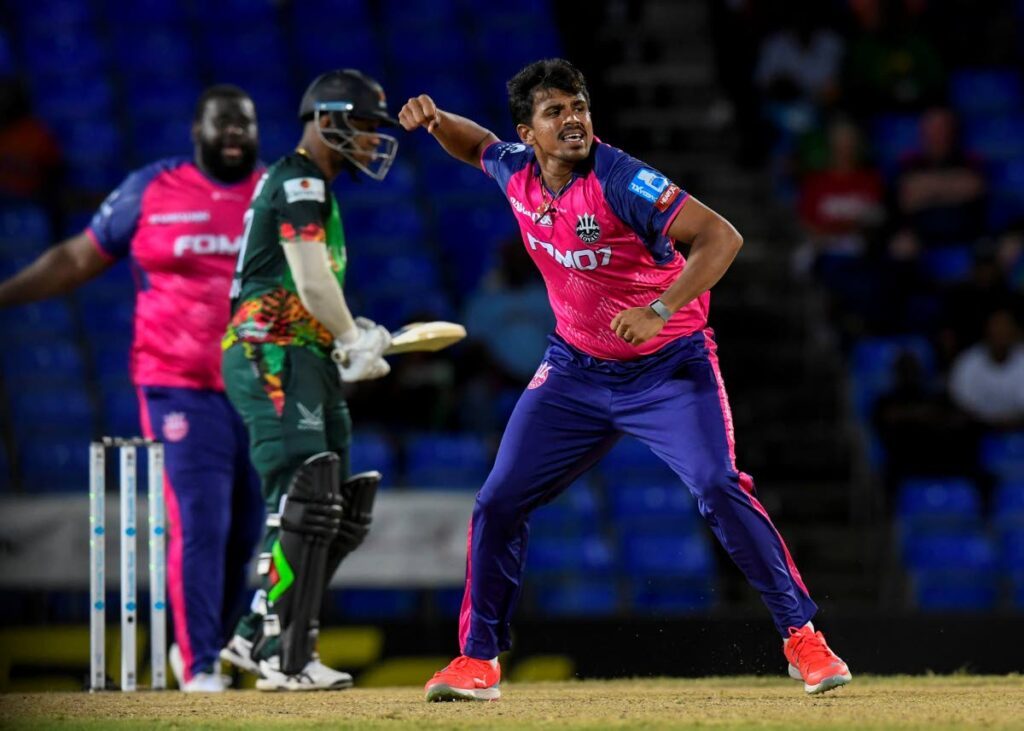 Sri Lanka and Barbados Royals spinner Maheesh Theekshana (R) celebrates the dismissal of Evin Lewis (C) during the 2024 Republic Bank CPL match against St Kitts and Nevis Patriots at Warner Park in Basseterre, St Kitts on September 6. (Photo courtesy Randy Brooks/CPL T20 via Getty Images) - 