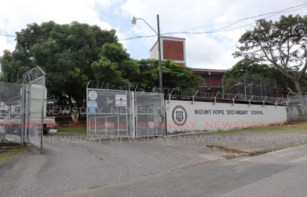 A vehicle drives onto the compound of Mount Hope Secondary School on Maingot Street, Mt Hope on September 4. - FILE PHOTO