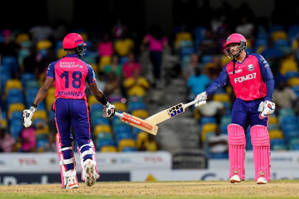 The Barbados Royals pair of Alick Athanaze, left, and Quinton de Kock share a moment during their 2024 Republic Bank CPL clash with Antigua and Barbuda Falcons at Kensington Oval in Barbados on September 11. - Photo courtesy Randy Brooks/CPL T20 via Getty Images) 