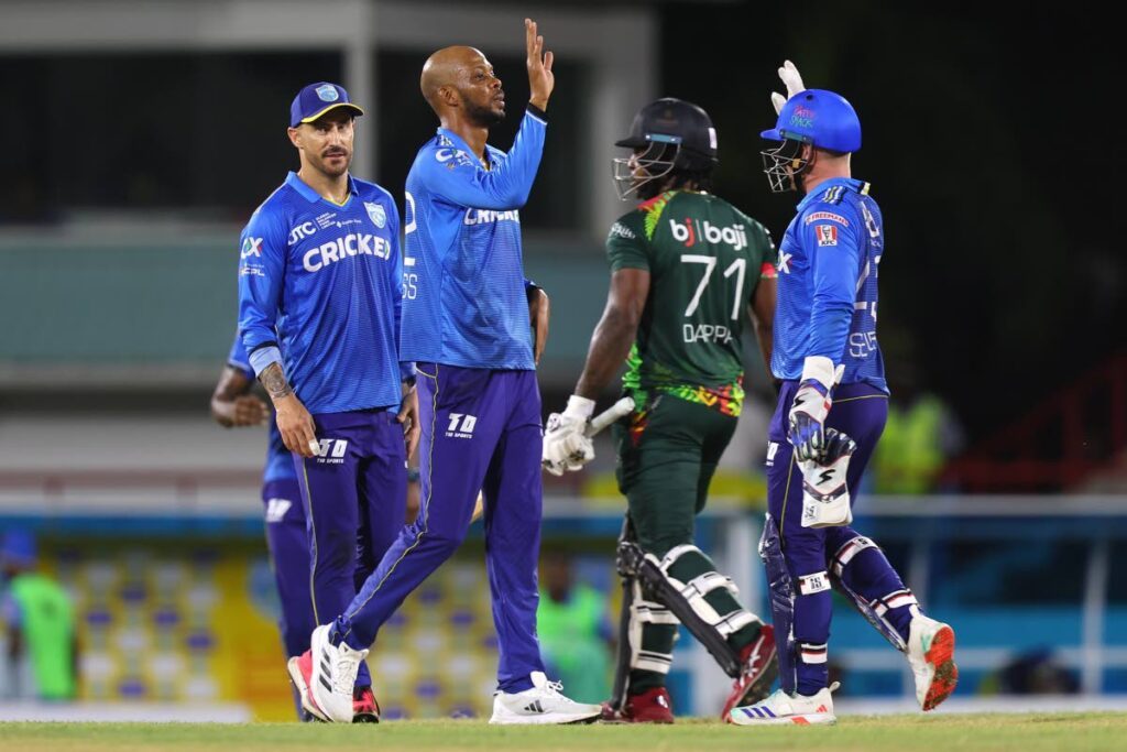 St Lucia Kings allrounder Roston Chase (second from left) celebrates with teammates after getting the wicket of Kyle Mayers during the 2024 Republic Bank CPL match against St Kitts & Nevis Patriots at the Daren Sammy Cricket Ground in Gros Islet, St Lucia on September 12. Photo courtesy Ashley Allen - CPL T20/CPL T20 via Getty Images.  - 