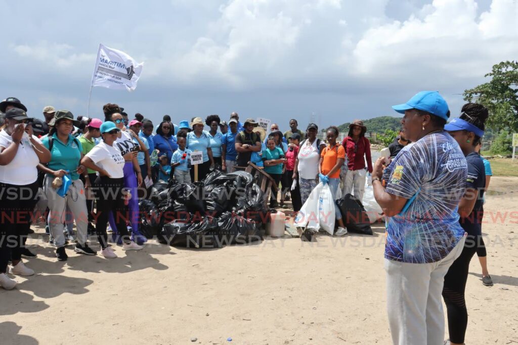 From right, Minister of Planning and Development Pennelope Beckles, speaks to the large audience of people who helped pick up litter at the International Coastal Clean-Up (ICC) hosted by Environmental Policy and Planning Division and the Environmental Management Authority on the shore of Chagville beach, Western Main Rd, Chaguaramas on September 14. - Photo by Faith Ayoung